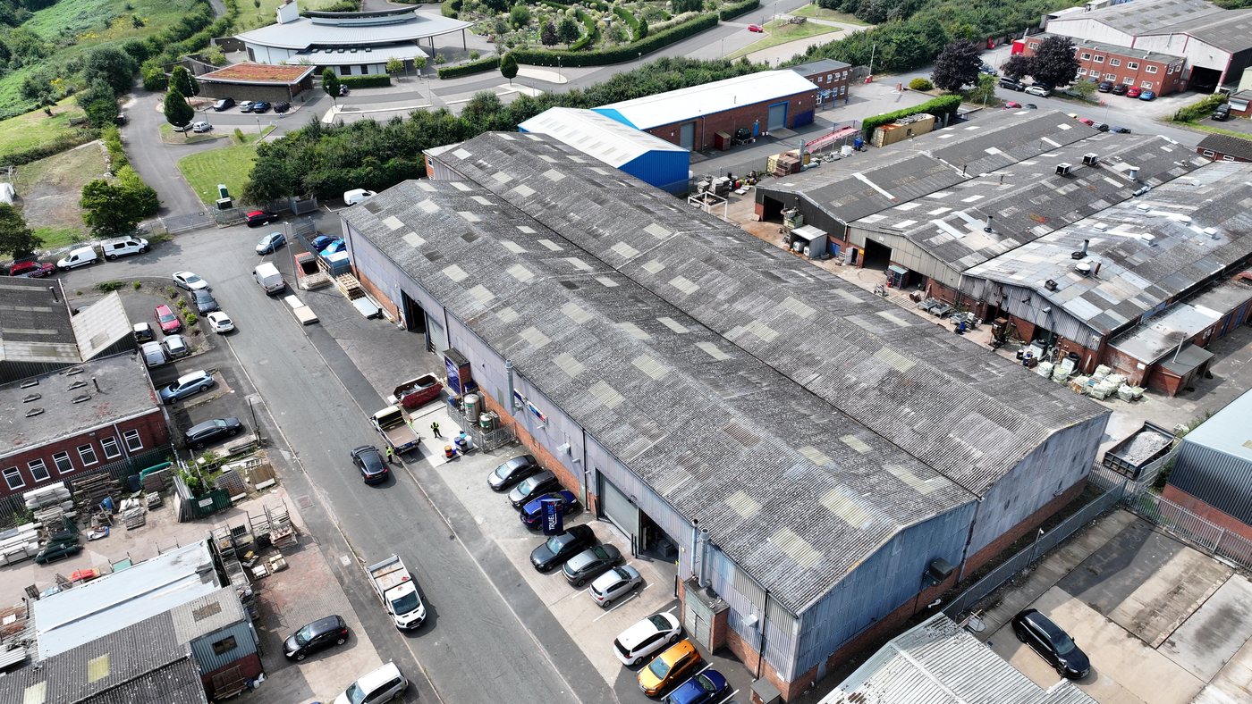Drone aerial of a commercial industrial roof captured by Solar Surveys -- the source data behind the contents of a roof condition survey report.
