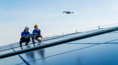 Engineer's boots on a commercial roof during a Solar Surveys walk-over inspection illustrating the comparison with drone-led surveys.