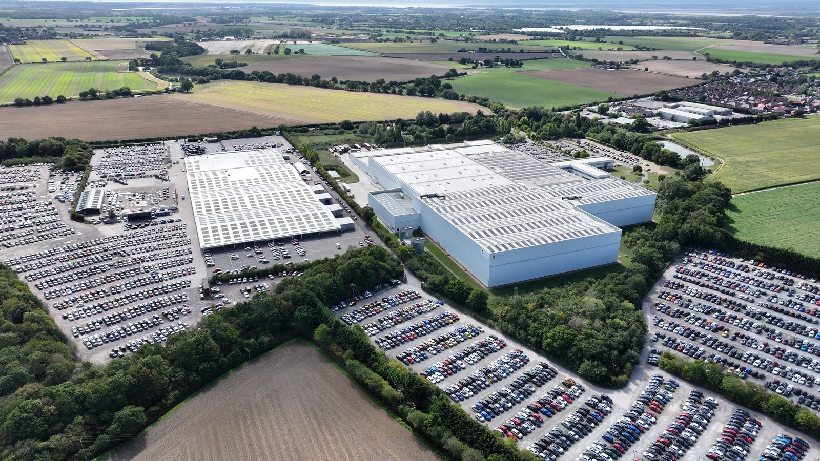 Aerial view of a large commercial building assessed for independent structural sign-off before solar installation.