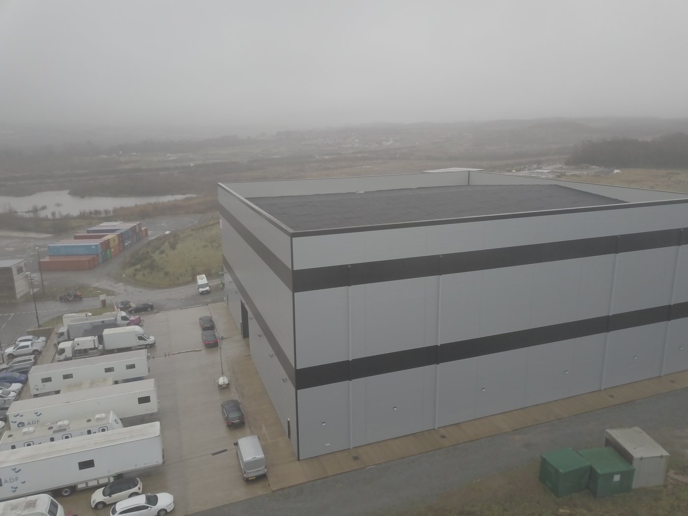 Wide aerial of an industrial-sector warehouse facility surveyed by Solar Surveys for sector-specific solar PV structural assessment