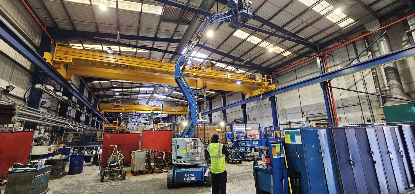 Steel portal frame interior with overhead crane the structural assemblies Solar Surveys engineers assess before solar PV sign-off.