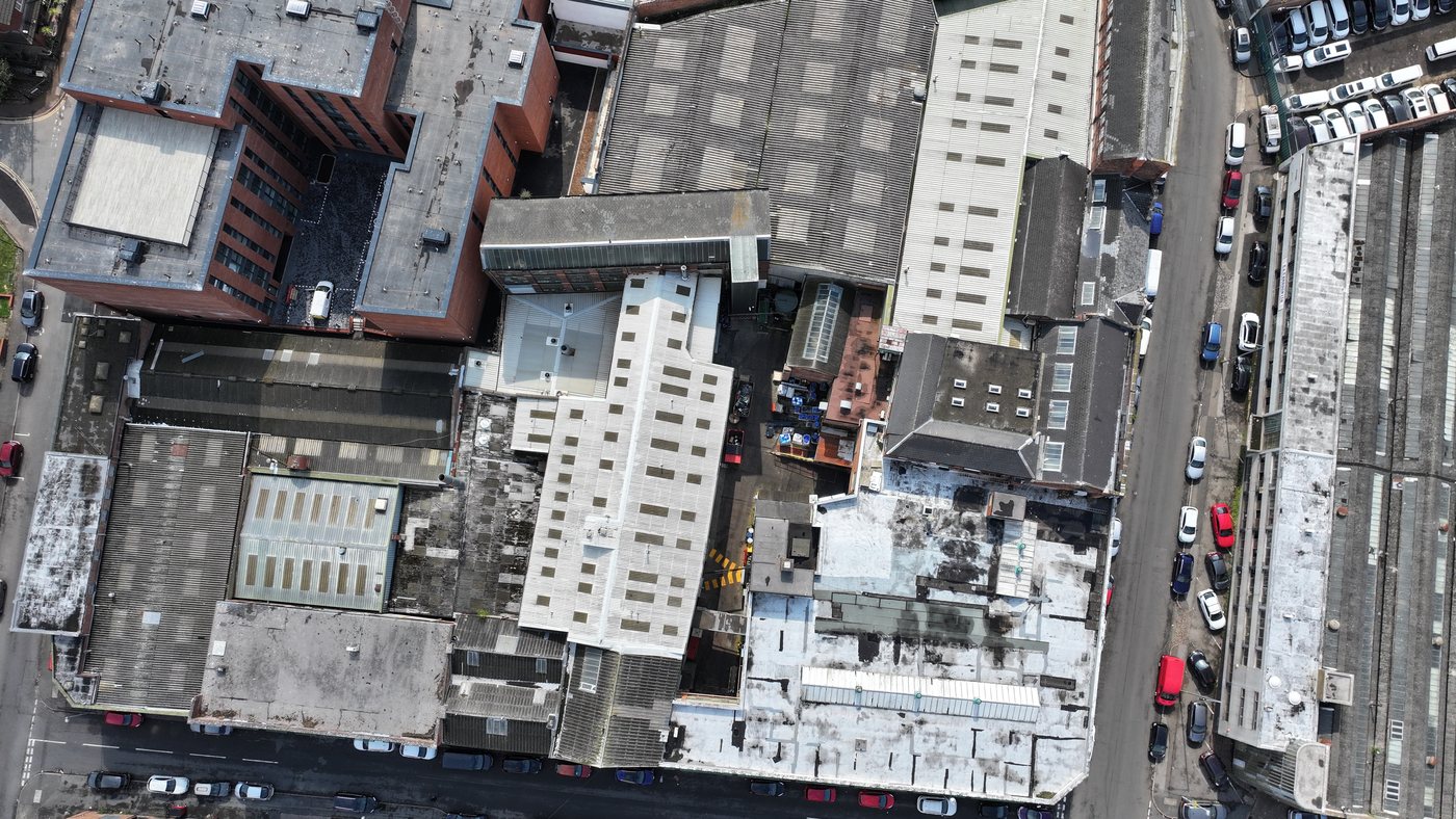Aerial of a multi-roof commercial complex inspected by Solar Surveys before solar PV installation.