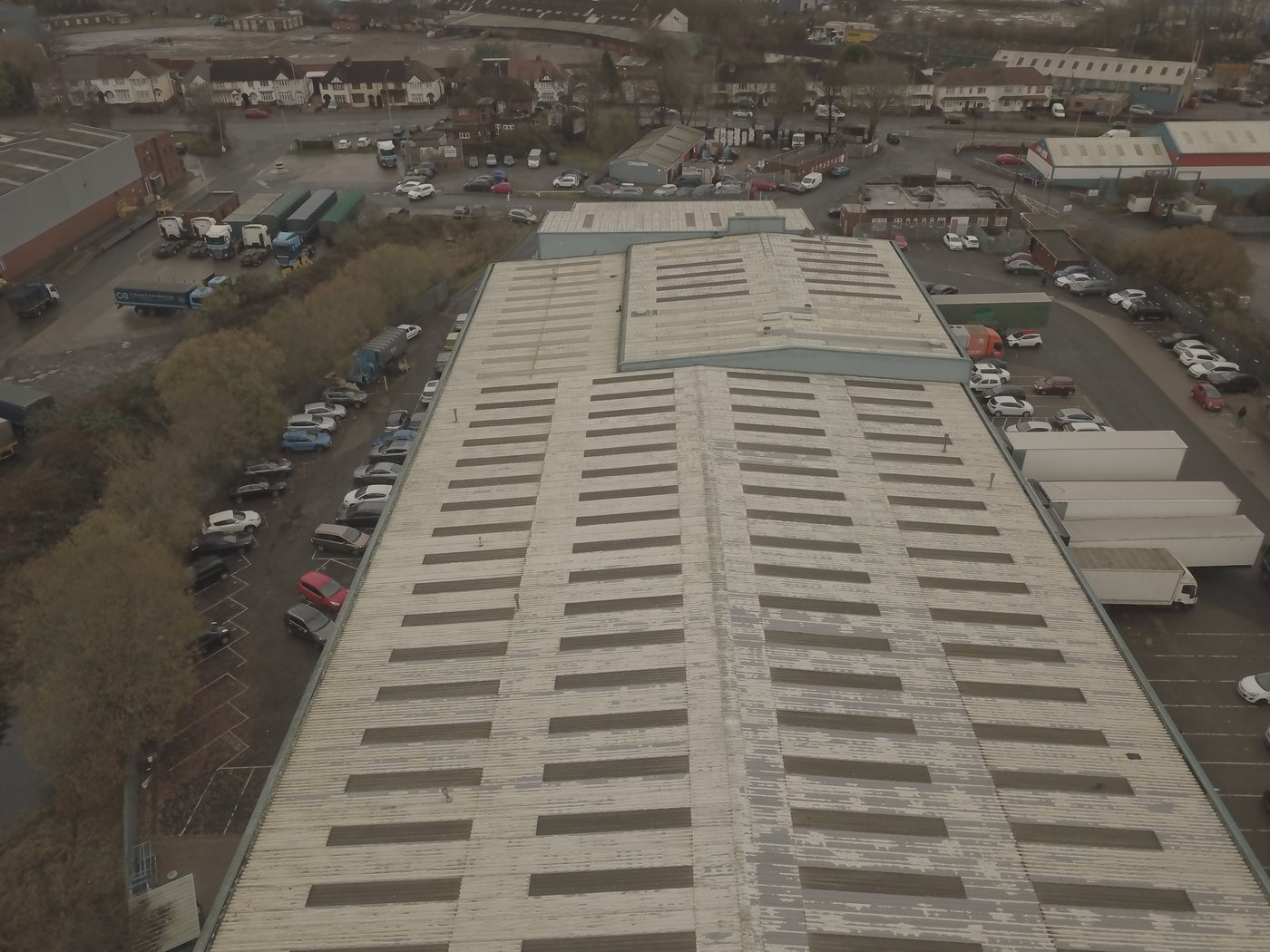 Aerial of a sheeted industrial-unit roof assessed by Solar Surveys, illustrating the cold-formed steel purlin types verified before solar PV installation