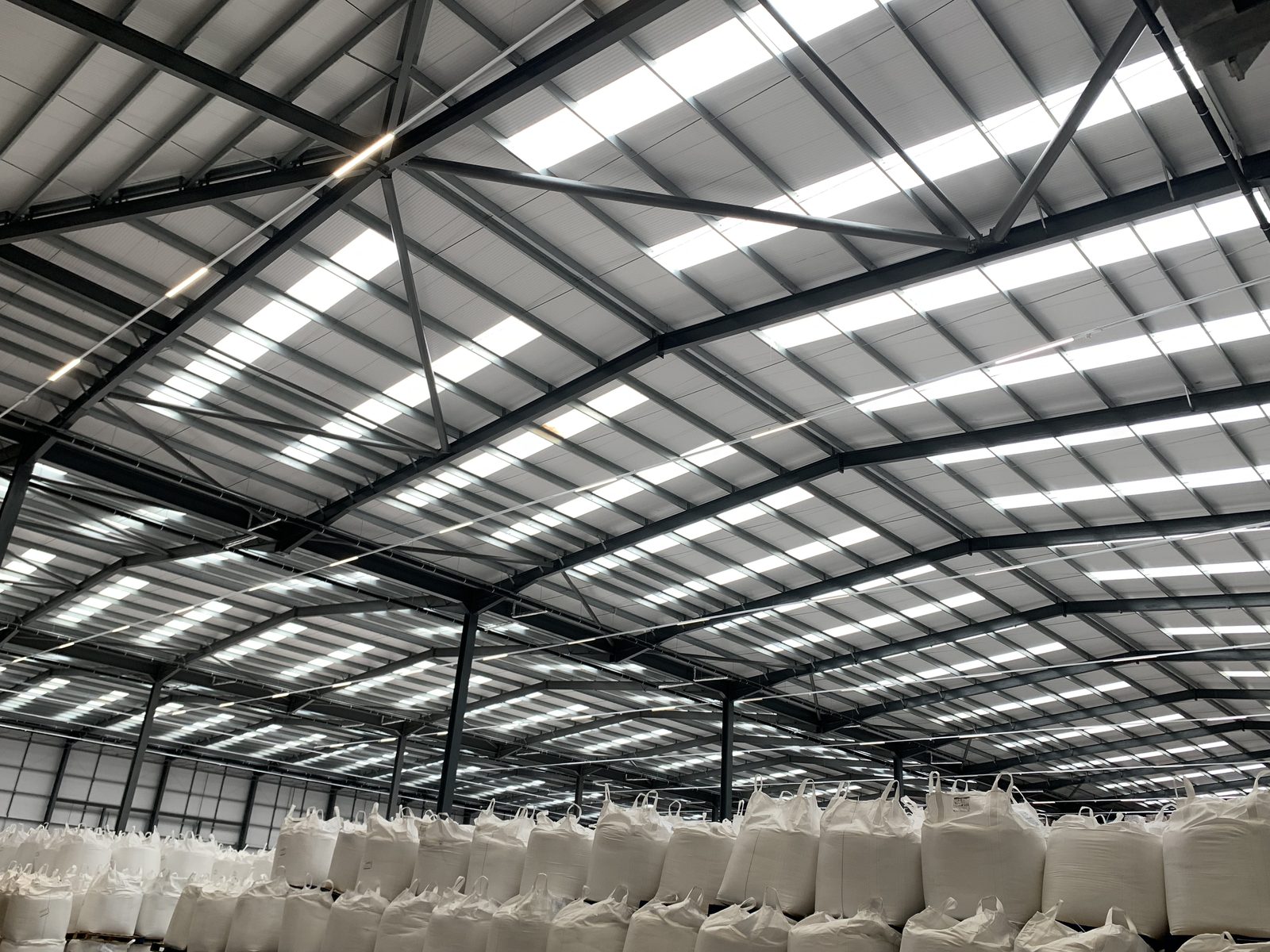 Internal steel roof frame of a commercial unit inspected during an on-site structural survey for solar PV.