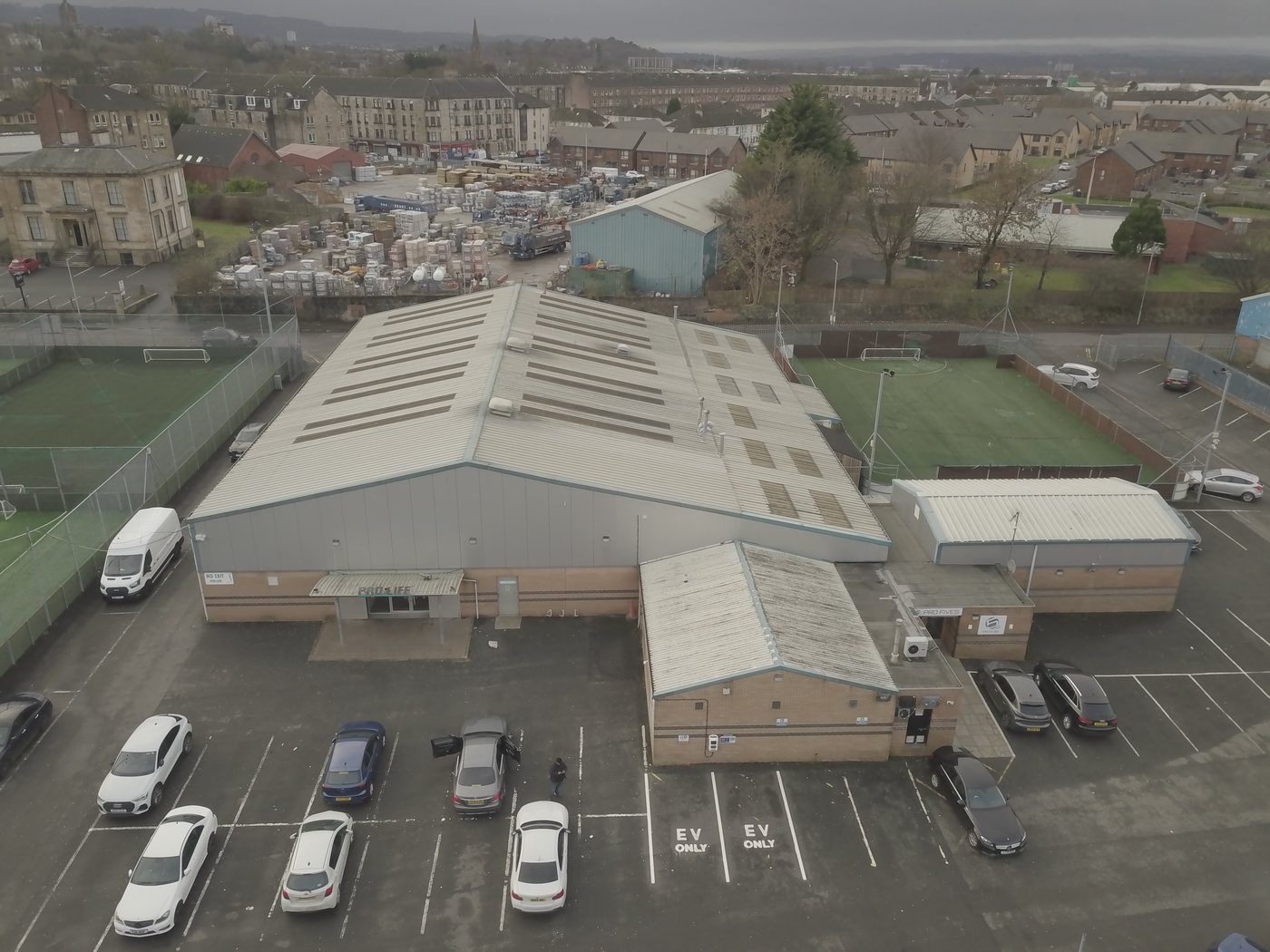 Aerial of an ageing single-storey industrial complex with a fragile sheeted roof surveyed by Solar Surveys for non-intrusive solar PV structural assessment and conversion to a solar-ready asset