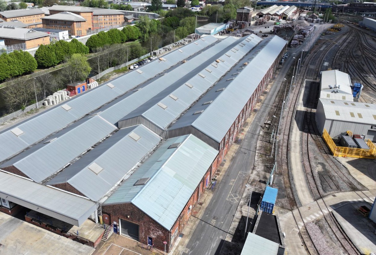 Aerial view of a fourteen-bay mill-type industrial roof complex assessed for a large rooftop solar scheme