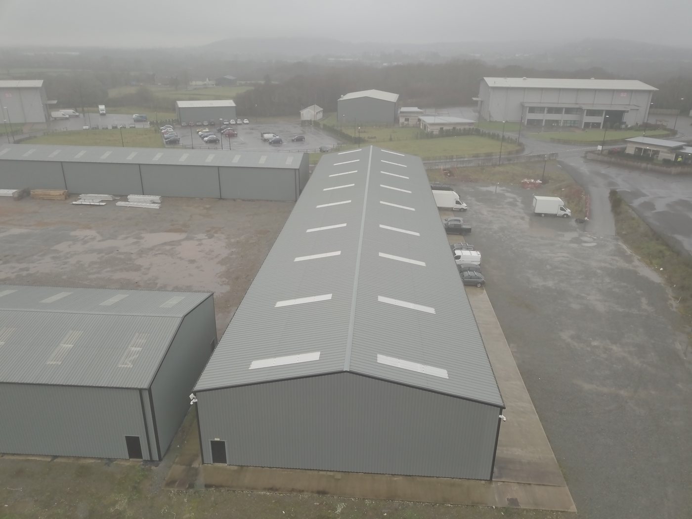 Aerial drone capture of a multi-building commercial estate baseline-documented by Solar Surveys for a 5-year planned preventive maintenance and insurance-compliance programme