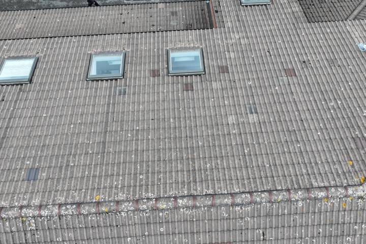 Concrete tile roof plane with roof windows from above