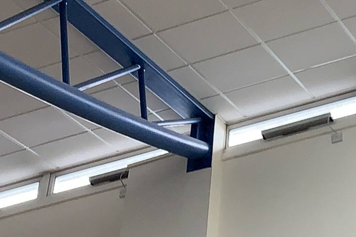 Steel lattice roof trusses inside a hall