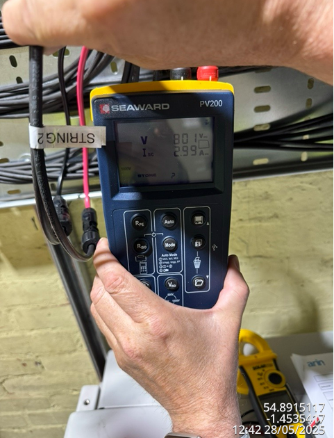 On-site I-V curve tester being used to verify solar PV string performance during DC side commissioning