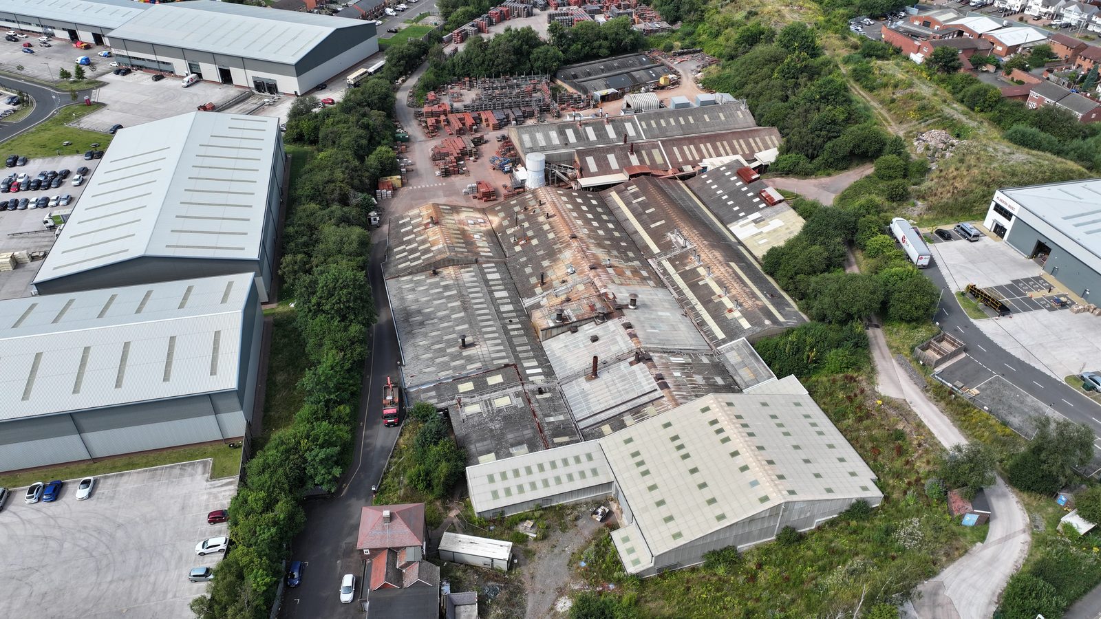 Aerial drone overview of commercial industrial roof: condition assessment context for the on-site structural survey